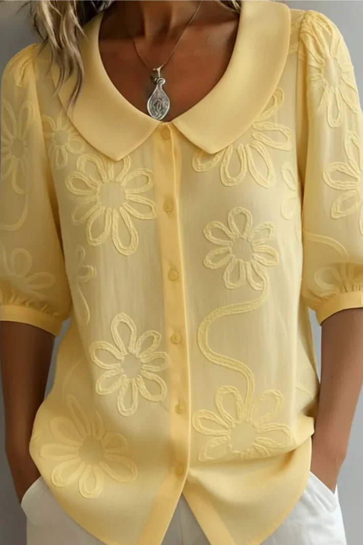 Anne - Elegante blusa con flores bordadas