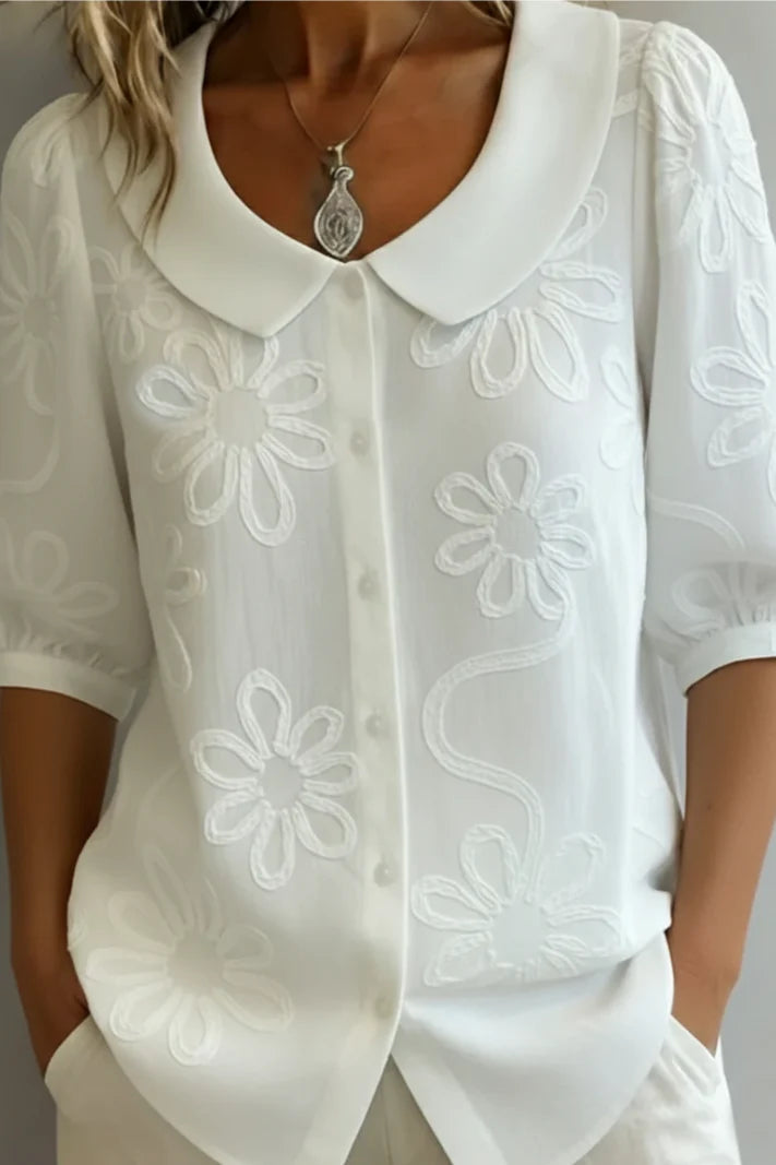 Anne - Elegante blusa con flores bordadas