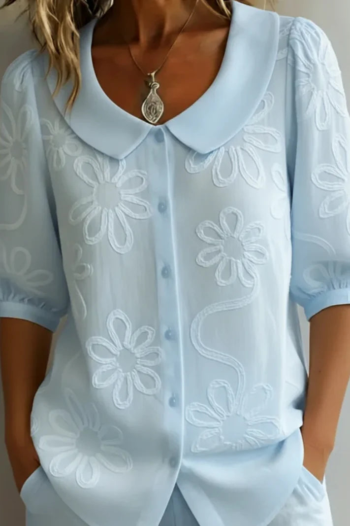 Anne - Elegante blusa con flores bordadas